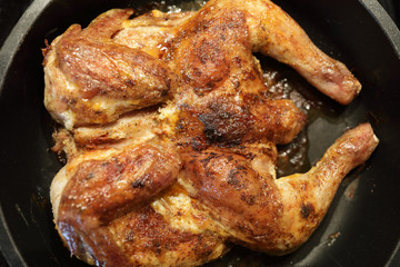 Baked chicken in frying pan