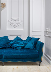 Blue couch in white interior