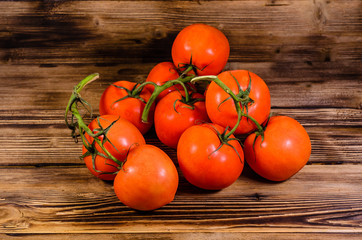 Fototapeta na wymiar Ripe tomatoes on wooden table