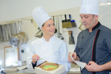 Chefs looking at colorful creation