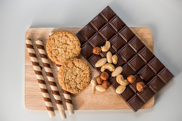 chocolate, milk chocolate with nuts, on a white background