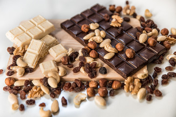 chocolate, milk chocolate with nuts, on a white background
