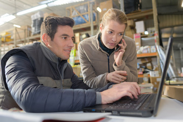 workers in warehouse office