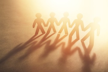 Paper people on brow background