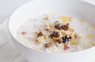 Muesli  bowl with  mix of unprocessed whole grains, nuts, seeds, fruit and vegan milk. Delicious breakfast meal for  energize your day. Heathy food lifestyle.