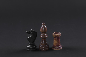 chess pieces on a black background