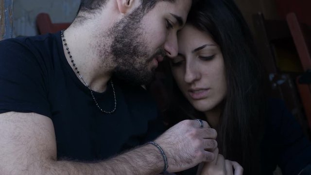 hard drug addiction: man injecting heroine in girlfriend in the arm