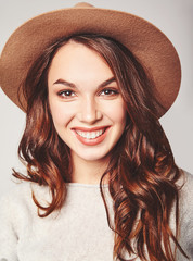 Portrait of young stylish laughing girl model in gray casual summer clothes in brown hat with natural makeup isolated on gray background. Looking at camera