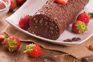 Chocolate roll with strawberries. 