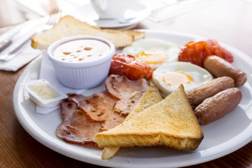 Egg and Toast - classical english breakfast with egg and ham