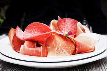 close up of tasty cold meats on the table