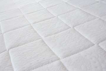 white mattress background and texture. concept : allergy in bed room, dust mites on bed.