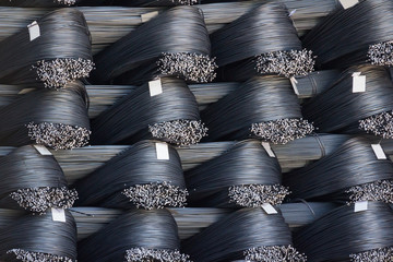 heap of round bar steel with blank paper tag,  new steel wire raw material ready to delivery from...