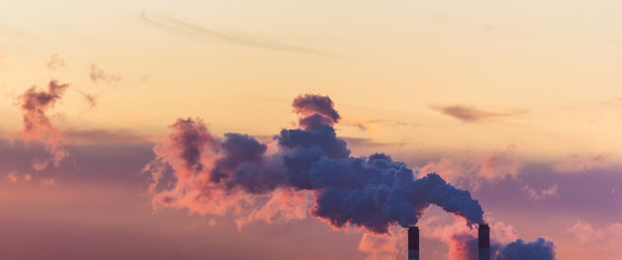 Smoking pipes of thermal power on sunrise