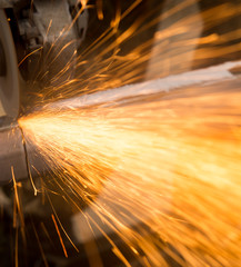 Sparks from metal cutting at the construction site