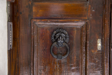 Old Wooden Entrance Door With Antique Door Handle Knob Made From Metal 