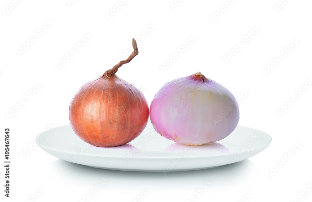 Wall mural Onions in white plate on white background