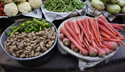 India, in the old town of Bikaner, a market stall with vegetables, carrots