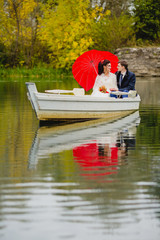 Couple newlyweds in the white boat
