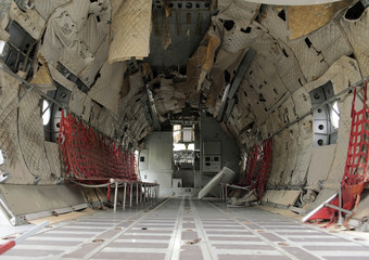 Interior of old military airplane cabin. Airplane cabin is defective.