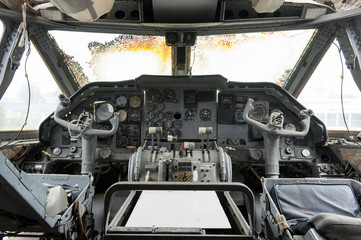Interior of old cockpit and airplane control panel is defective.