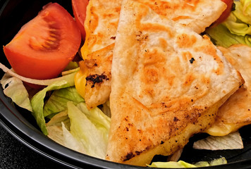 Freshly made Cheese Quesadillas bowl studio photo