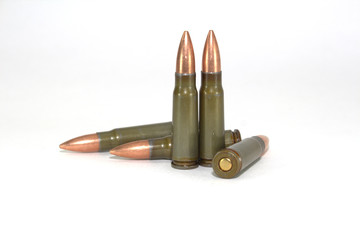Five rounds for a Kalashnikov rifle machine on a white background close-up
