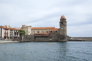 View of village Collioure in Cote Vermeille coast. Tower and church.France.