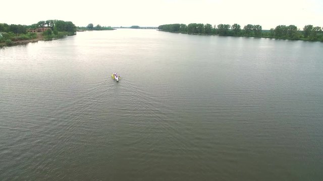 Rowing and Canoeing. The view from the drone on the river swimming athletes Aerial