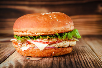 Chickenburger on a wooden background