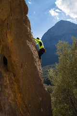 the rock-climber on a route with the lower insurance
