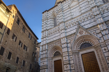 Fototapeta na wymiar Siena, Italy: historic buildings, the cathedral (Duomo)