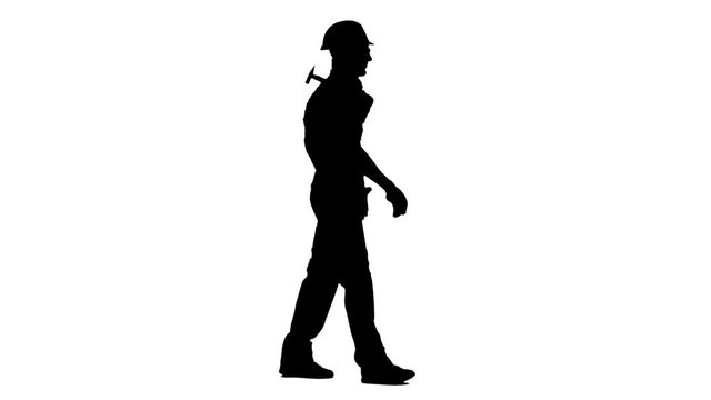 Man builder with a hammer in his hands goes to the construction site. White background. Silhouette. Side view