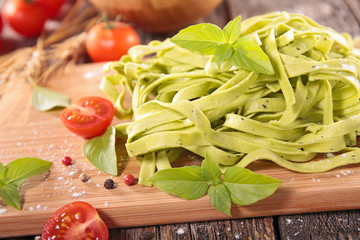 raw tagliatelle and basil
