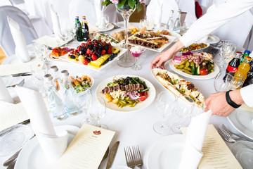 Set the table with different dishes for a Banquet.