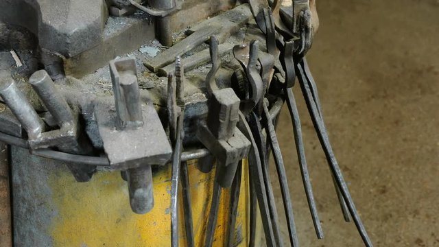 Metal tools in the blacksmith shop ready to work.