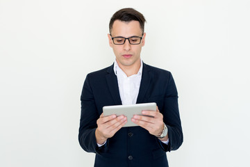 Serious Attractive Business Man Using Tablet