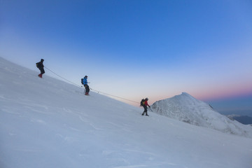 Fototapeta na wymiar Alpinism expedition team is returning home. Mont Blanc, France