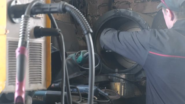 Making the knife out of metal at the forge. Heating of metal billets in the furnace.