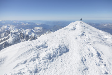Fototapeta na wymiar Mountaineering ascending to the top of mount Mont Blanc in French Alps. Chamonix, France