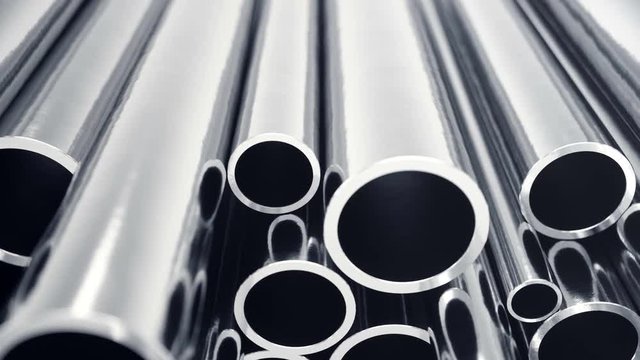 Industry business production and heavy metallurgical industrial products, many shiny steel pipes, industrial background, manufacturing business production concept with selective focus effect. 4k 3D