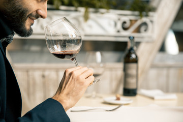 Winemaker with wine glass in restaurant