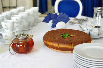 Cut pie on the table, tea, cooked for breakfast