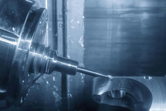 The 5 axis CNC machine cutting the automotive part with the solid ball end mill.