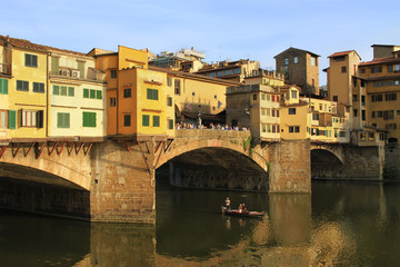 Ponte Vecchio - Old Bridge, famous stone bridge  with shops built along it, over the river Arno, Florence, Tuscany, Italy.