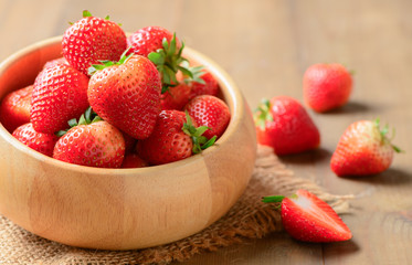 fresh Red berry strawberries in wood bowl