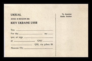 vintage empty QSL radio card, kiev, ukraine, ussr, circa 1980s. paper document isolated on black background 