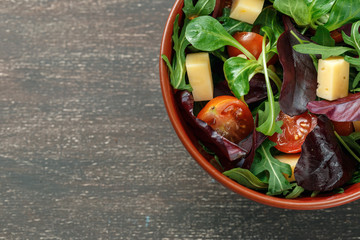 Fresh spring salad mix with tomatoes and cheese
