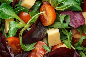 Fresh spring salad mix with tomatoes and cheese