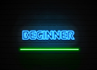 Obraz premium Beginner neon sign mounted on brick wall.